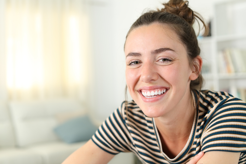 Woman with a bright, white smile: representative result of cosmetic dentistry for patients in the Glenridge, NJ community